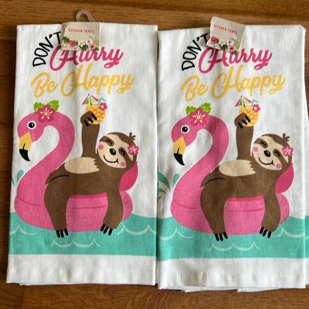 Two ritz kitchens towels. Sloth on flamingo float